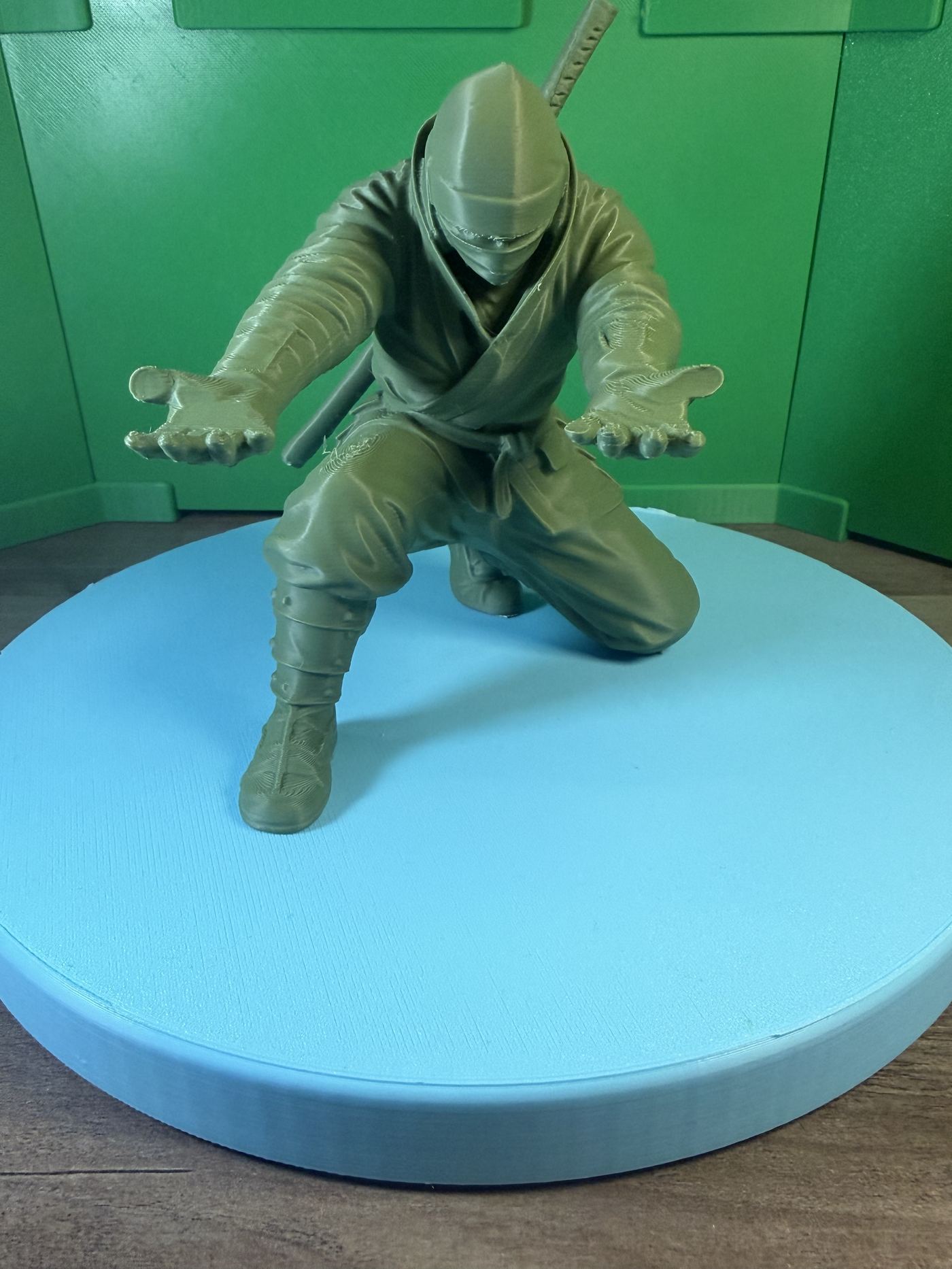 Articulated ninja figure in a crouched pose